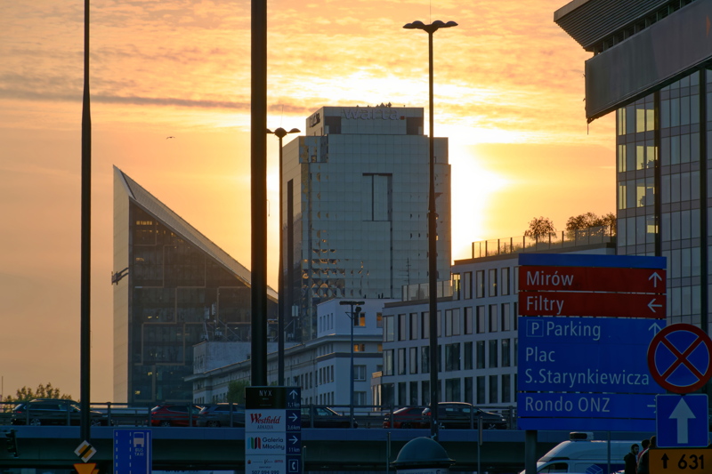 26 - View of the Warsaw skyline, featuring modern skyscrapers like the Warsaw Spire against a sunset